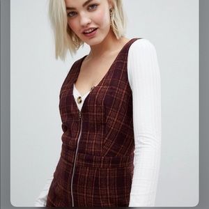 Sleek Plaid Jumpsuit. Deep v-neck Warm pantsuit from EMORY PARK. Business casual